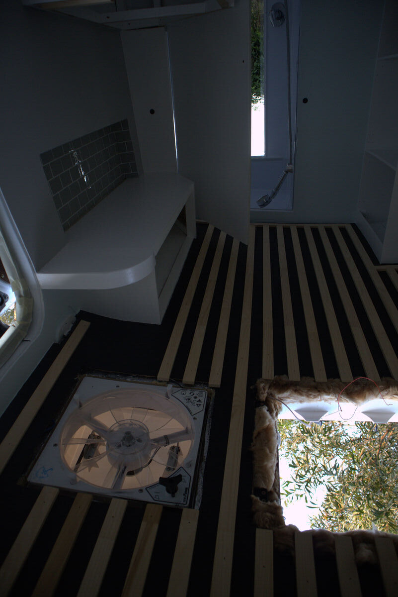 Pine strips being installed on the painted roof